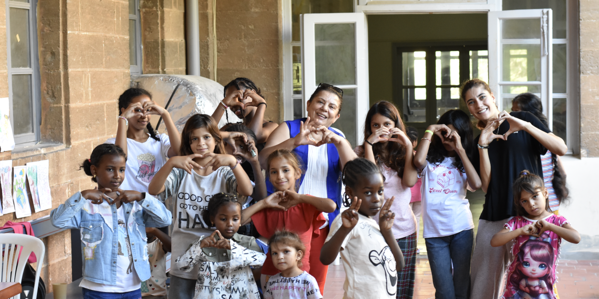 Refugees at a migrant center in Lebanon. Read stories from JRS staff and refugees worldwide.